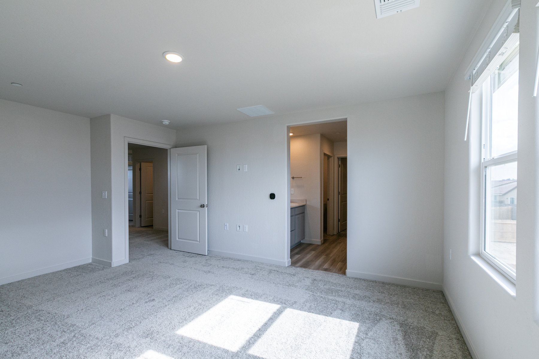 A room with white walls and a tile floor.