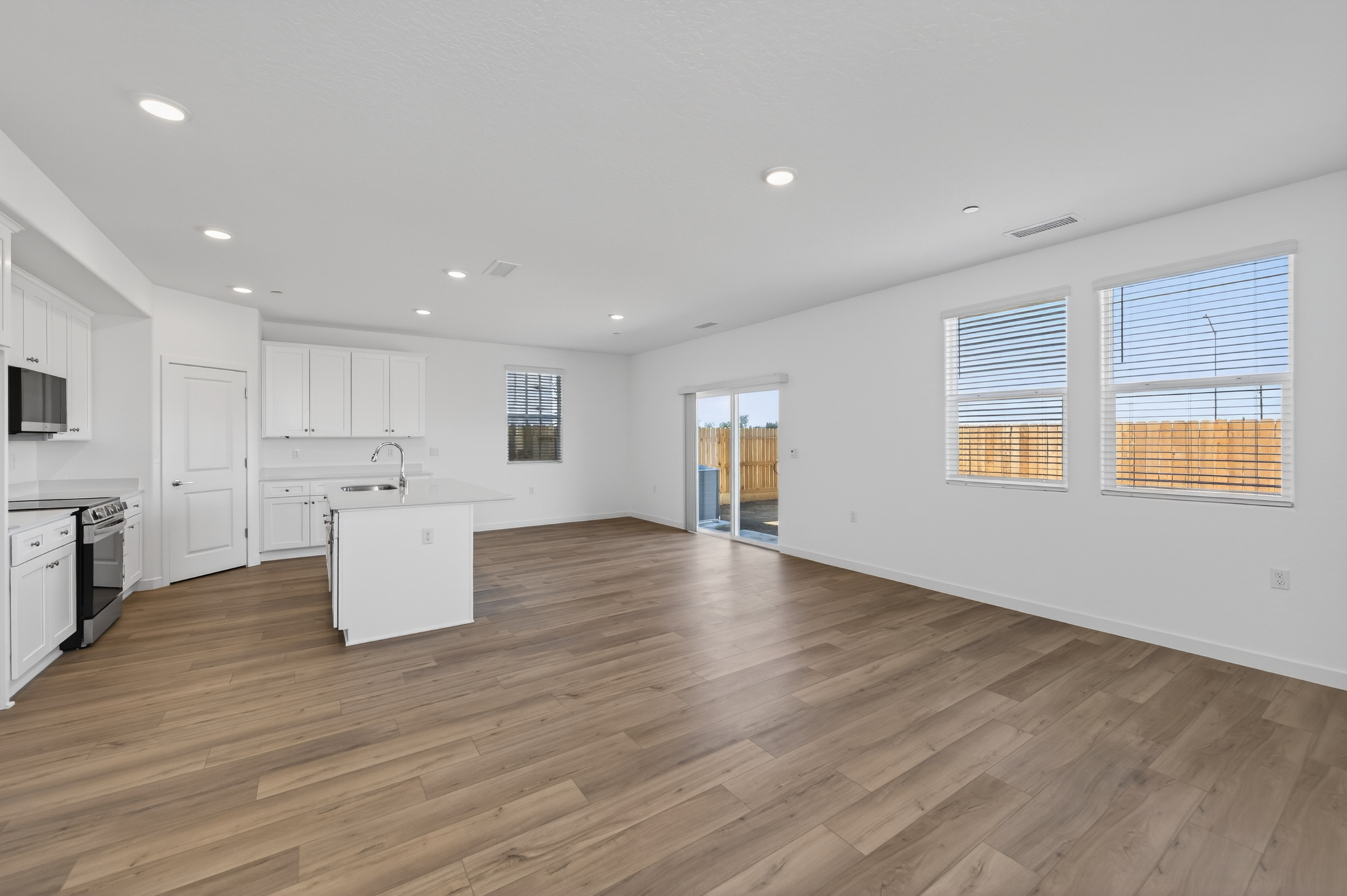A large kitchen with white cabinets.