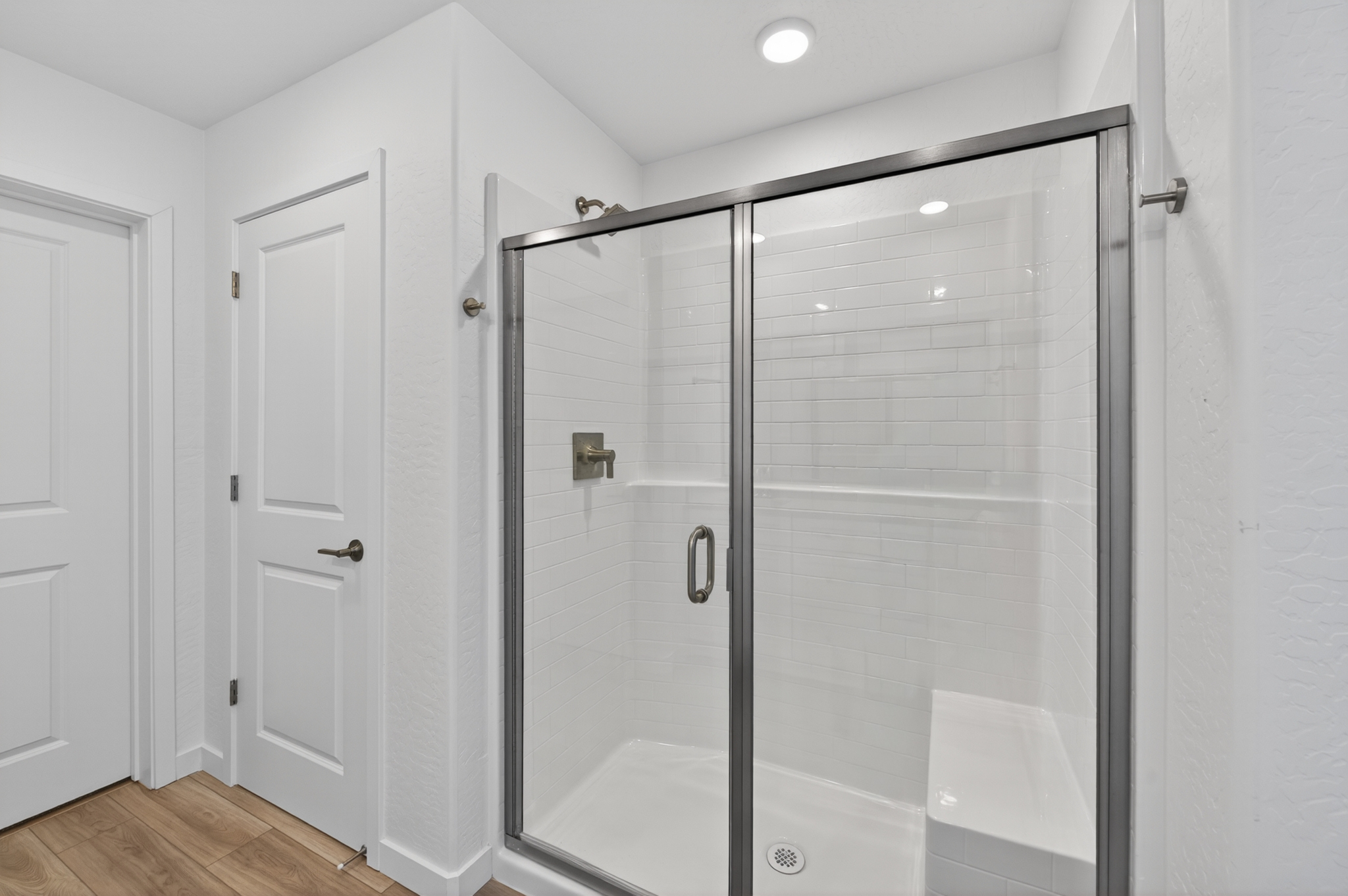 A bathroom with a glass shower.