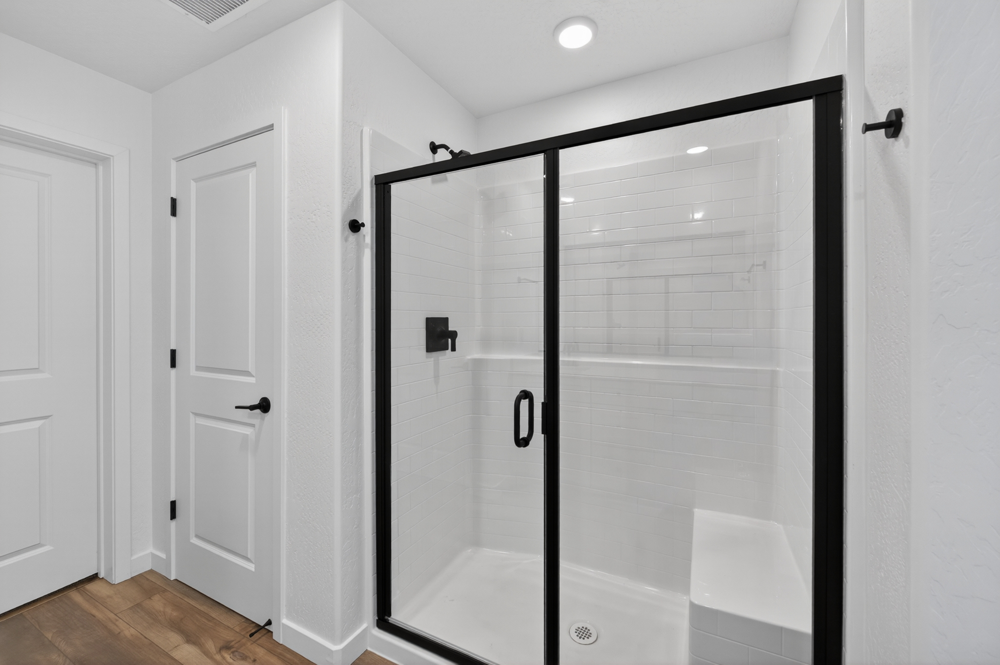 A bathroom with a glass shower.