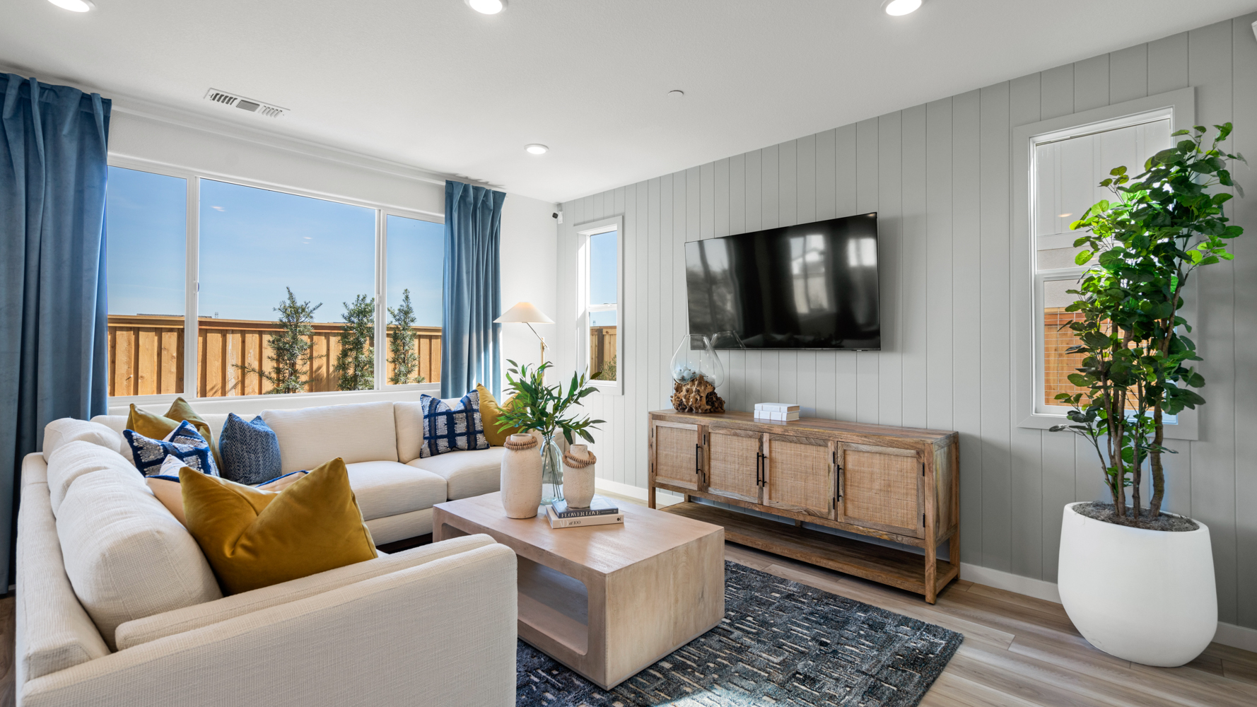 A living room with a tv and couches.