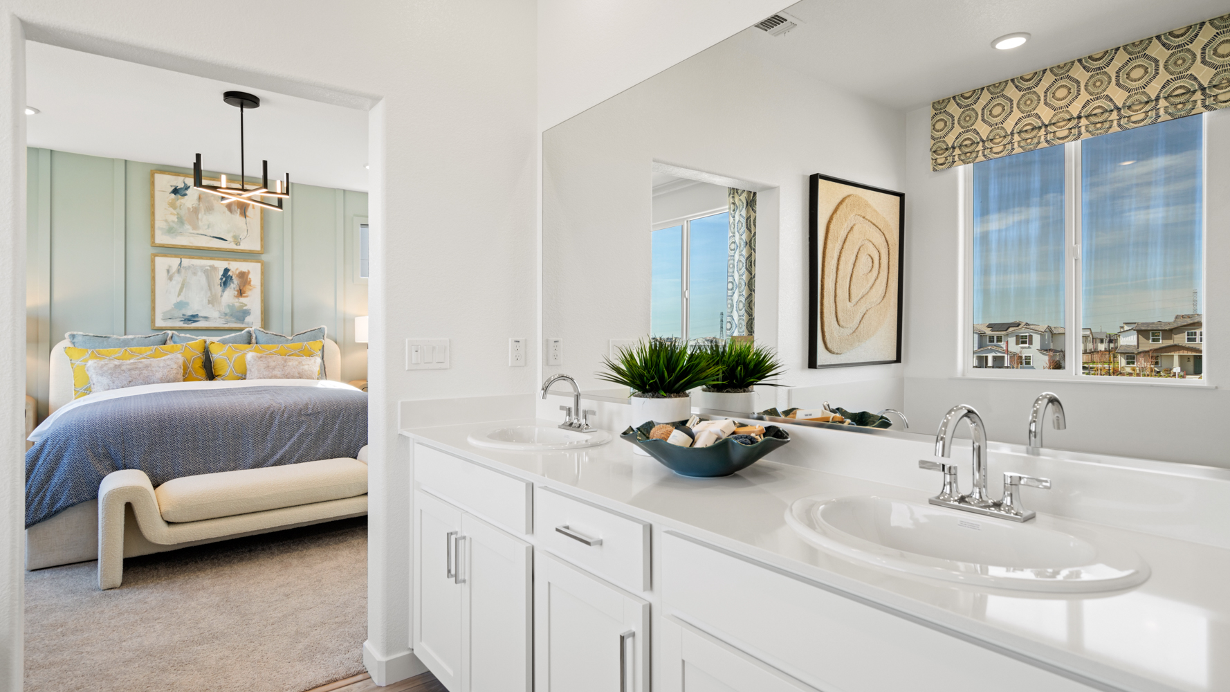 A bathroom with a tub sink and a bed.