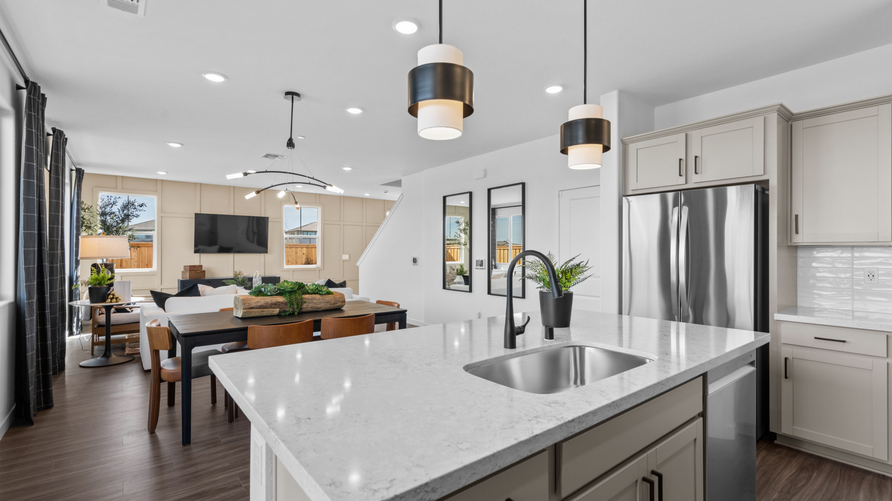 A kitchen with a bar and island.