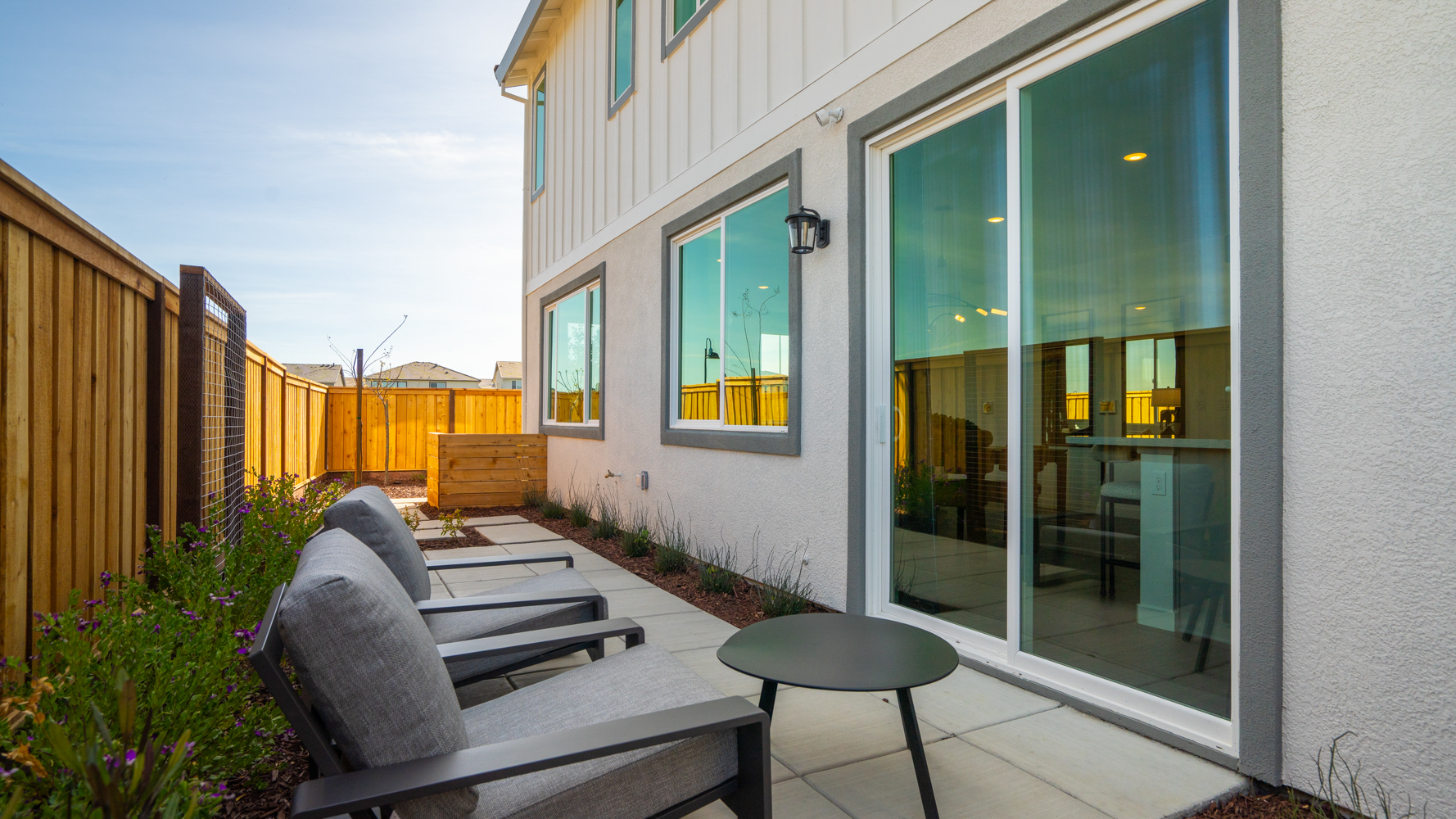 A patio with a table and chairs.