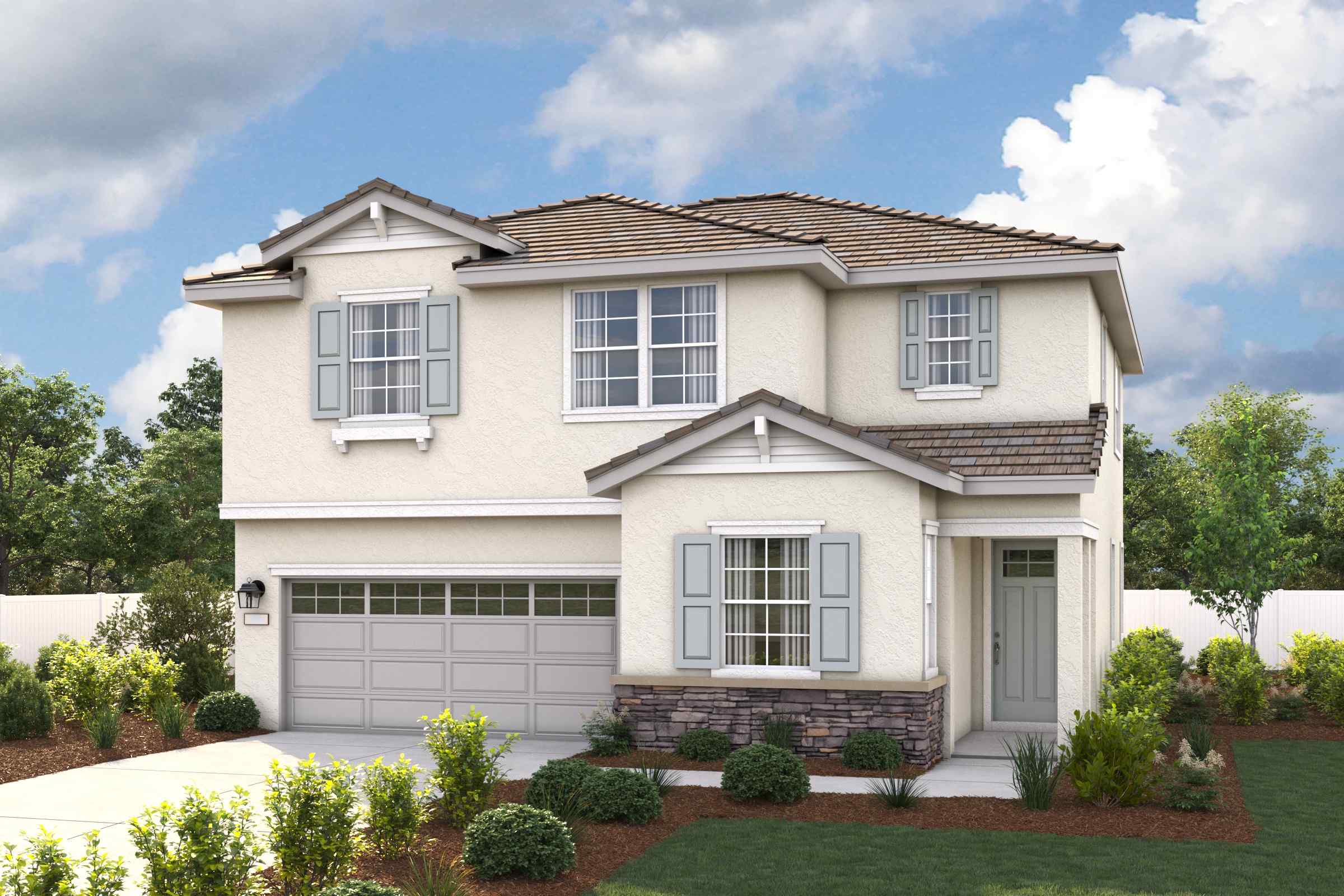 A house with a garage and a lawn in front of it.