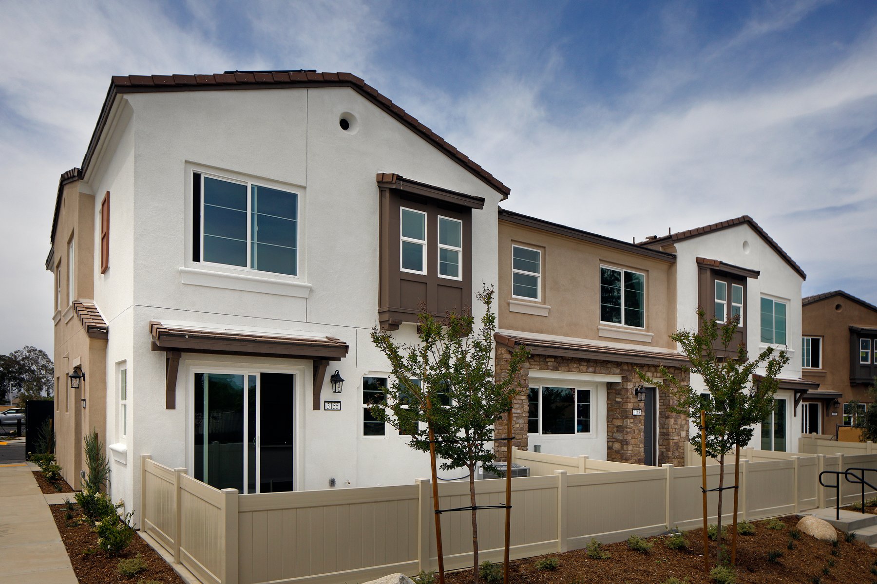 A white house with a fence.