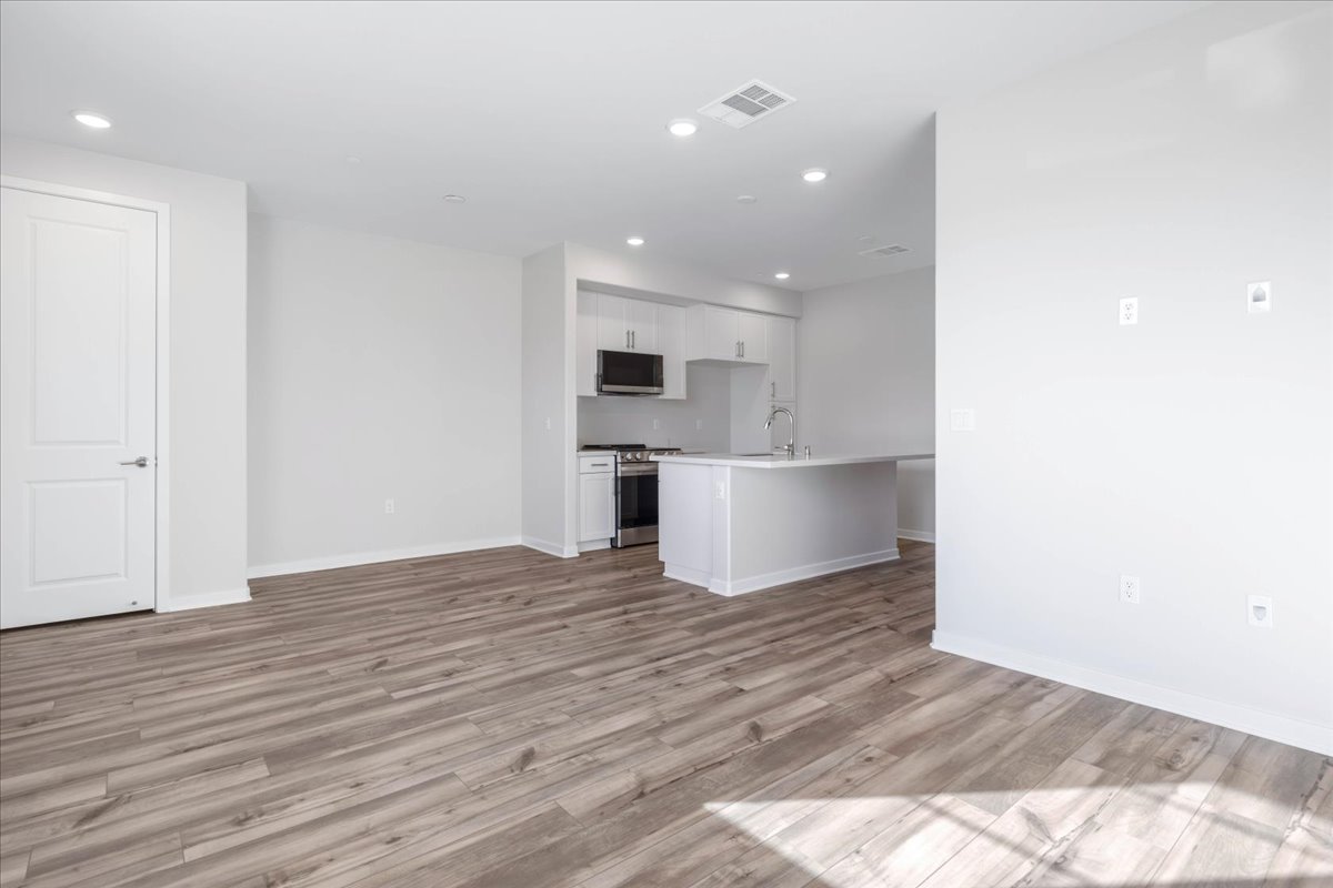A kitchen with white walls.