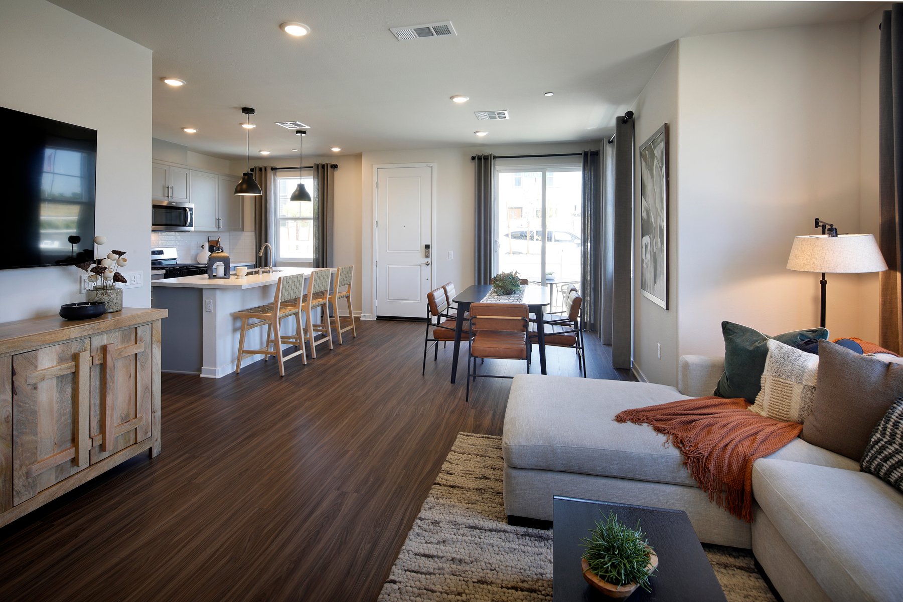 A living room with a wood floor.