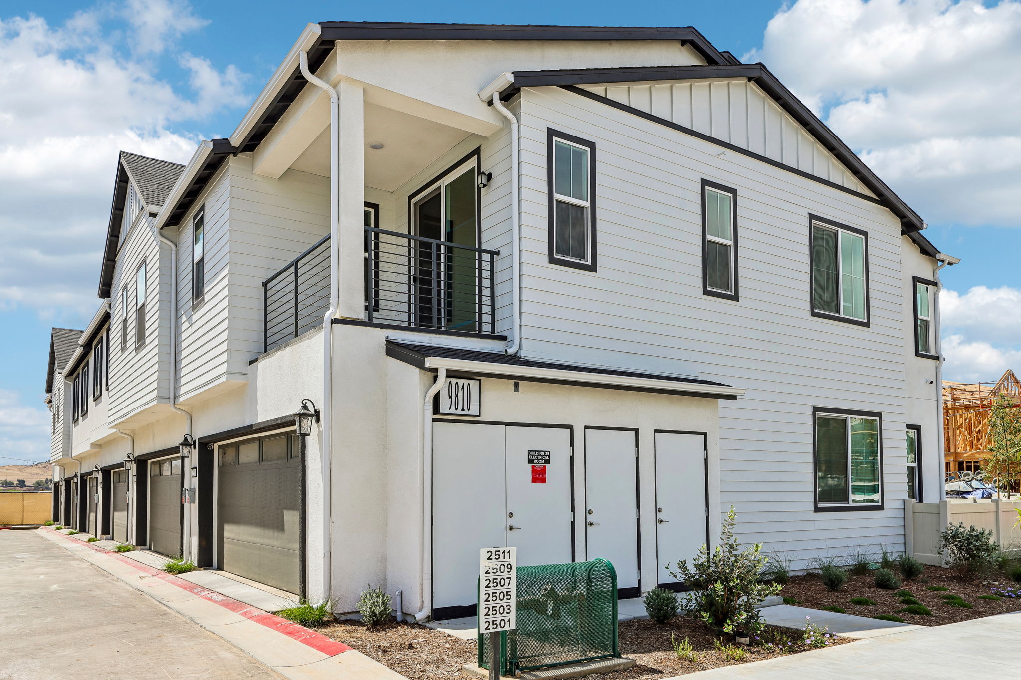 A white building with a garage with Roald Dahl Museum and Story Centre in the background.