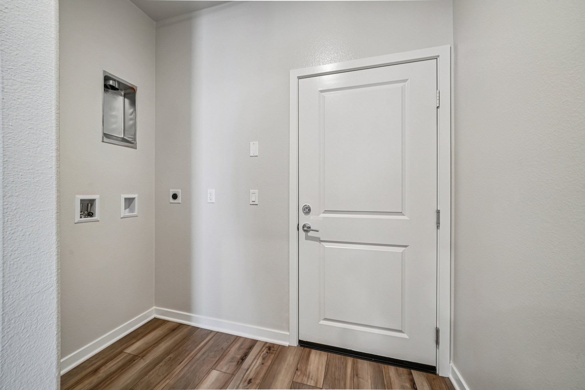 A white door in a room.