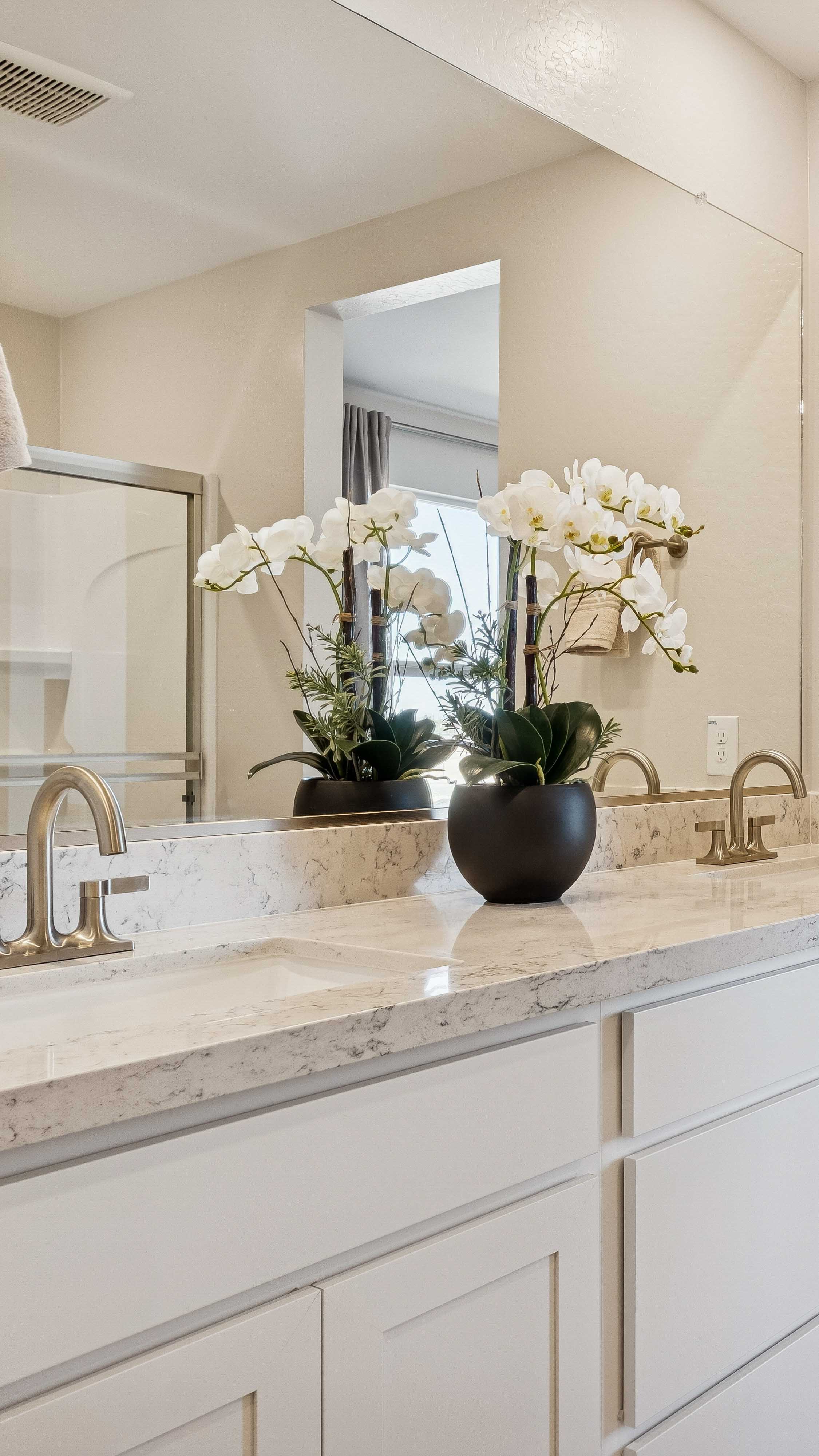 Bathroom vanity in primary suite in the lanner floor plan with a built in desk and cabinets North Copper Canyon Vistas II Collection new construction homes for sale in surprise az find your dream home