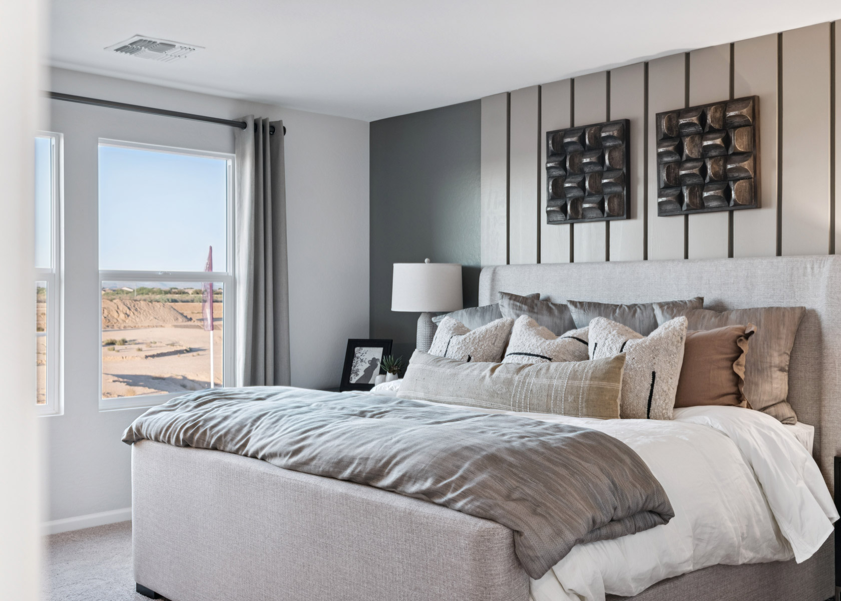 A bedroom with a large bed.