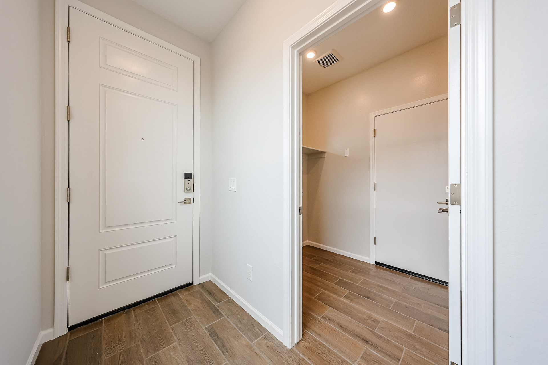A hallway with white doors.