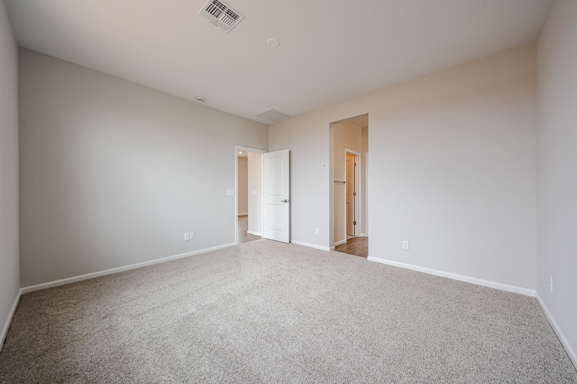 A hallway with white walls.
