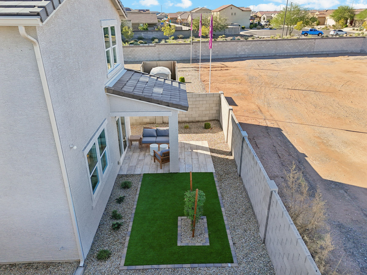 A small backyard with a pool.