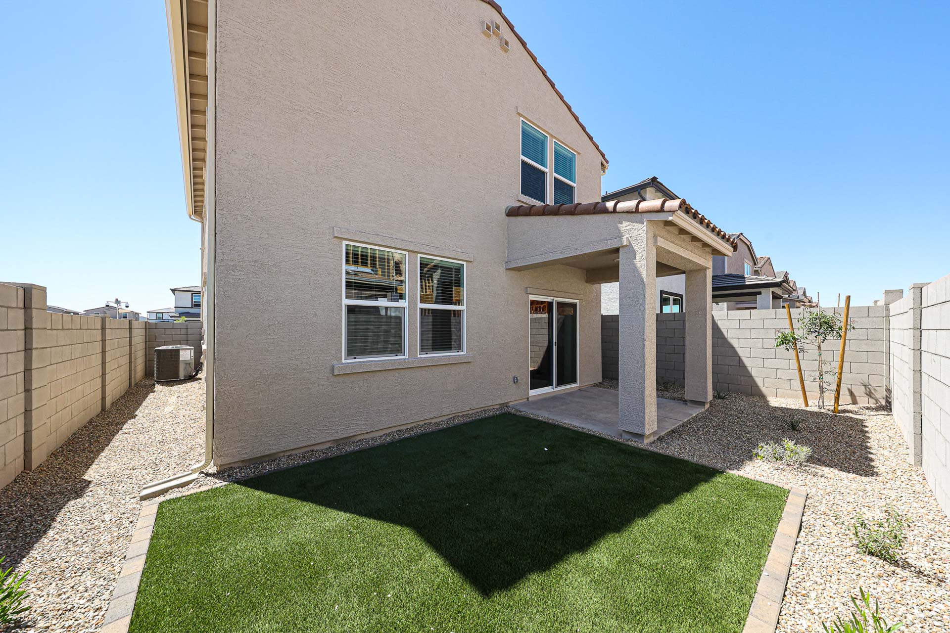 A house with a green lawn.