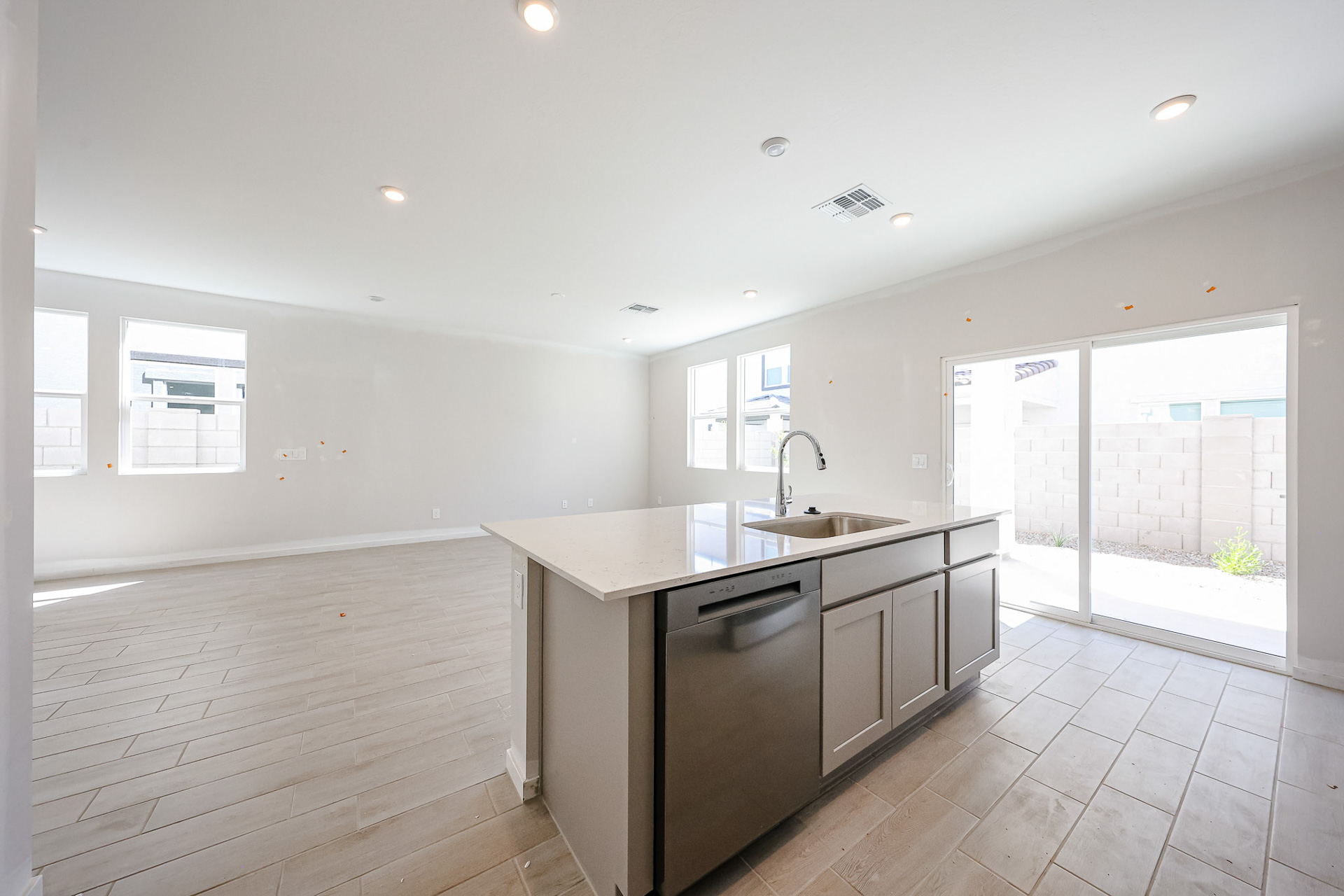 A kitchen with a large glass door.