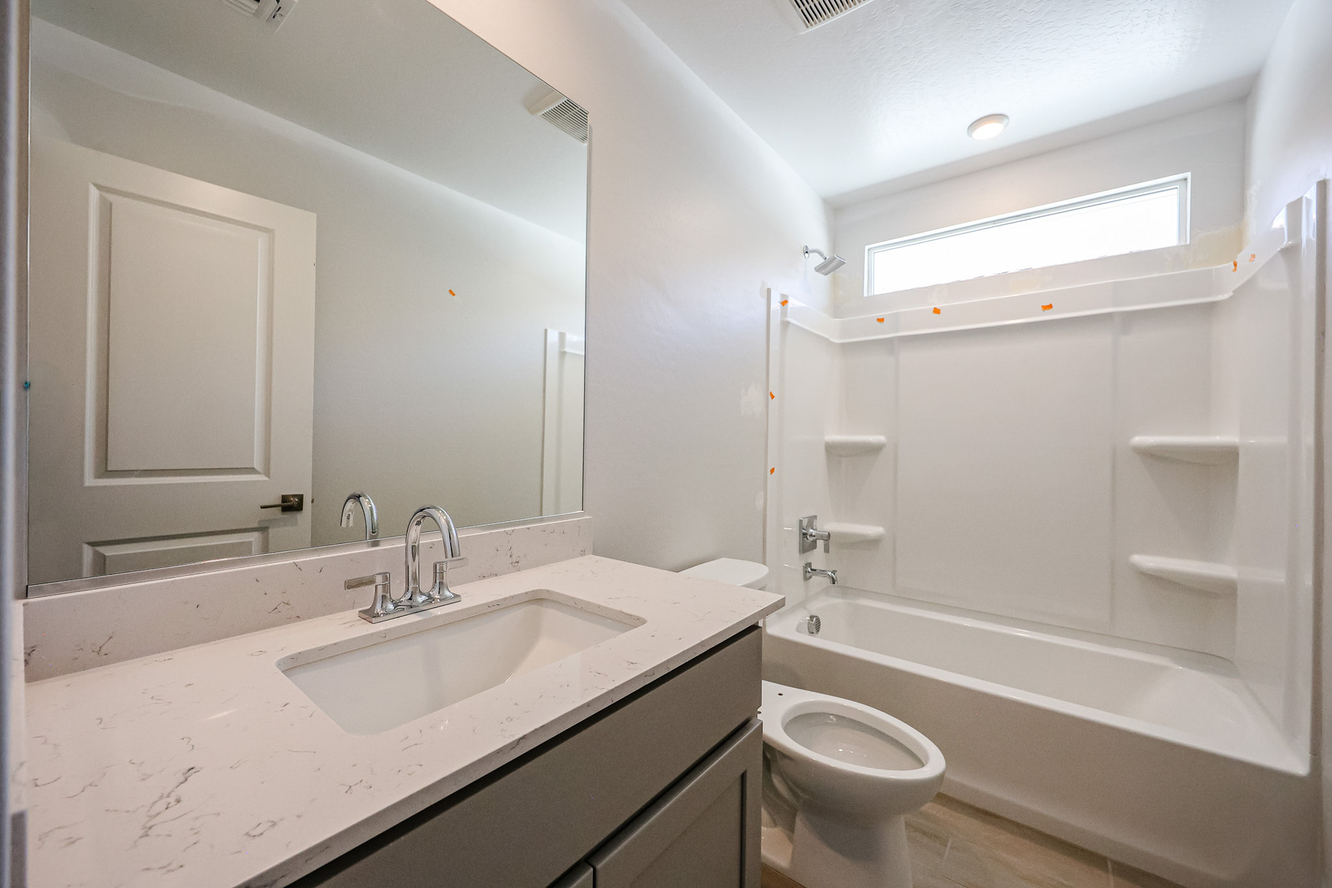 A bathroom with a sink and a toilet.