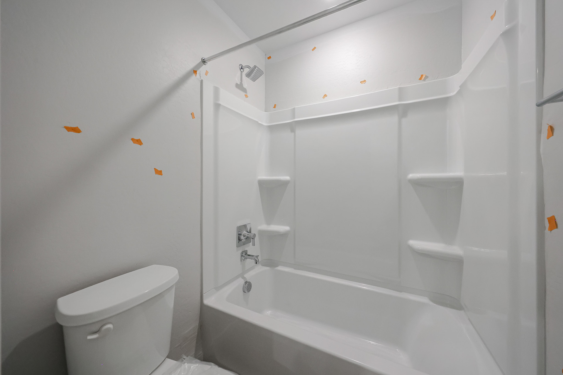 A bathroom with a tub toilet and sink.