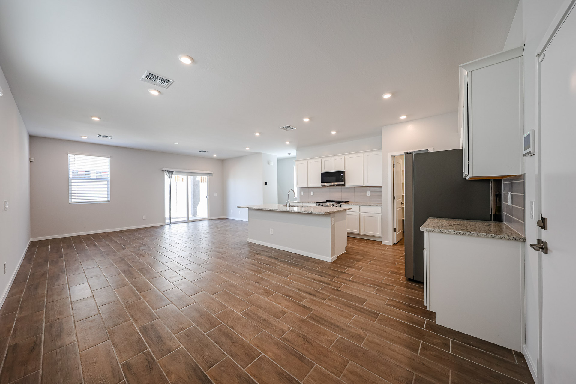 A large kitchen with white cabinets.