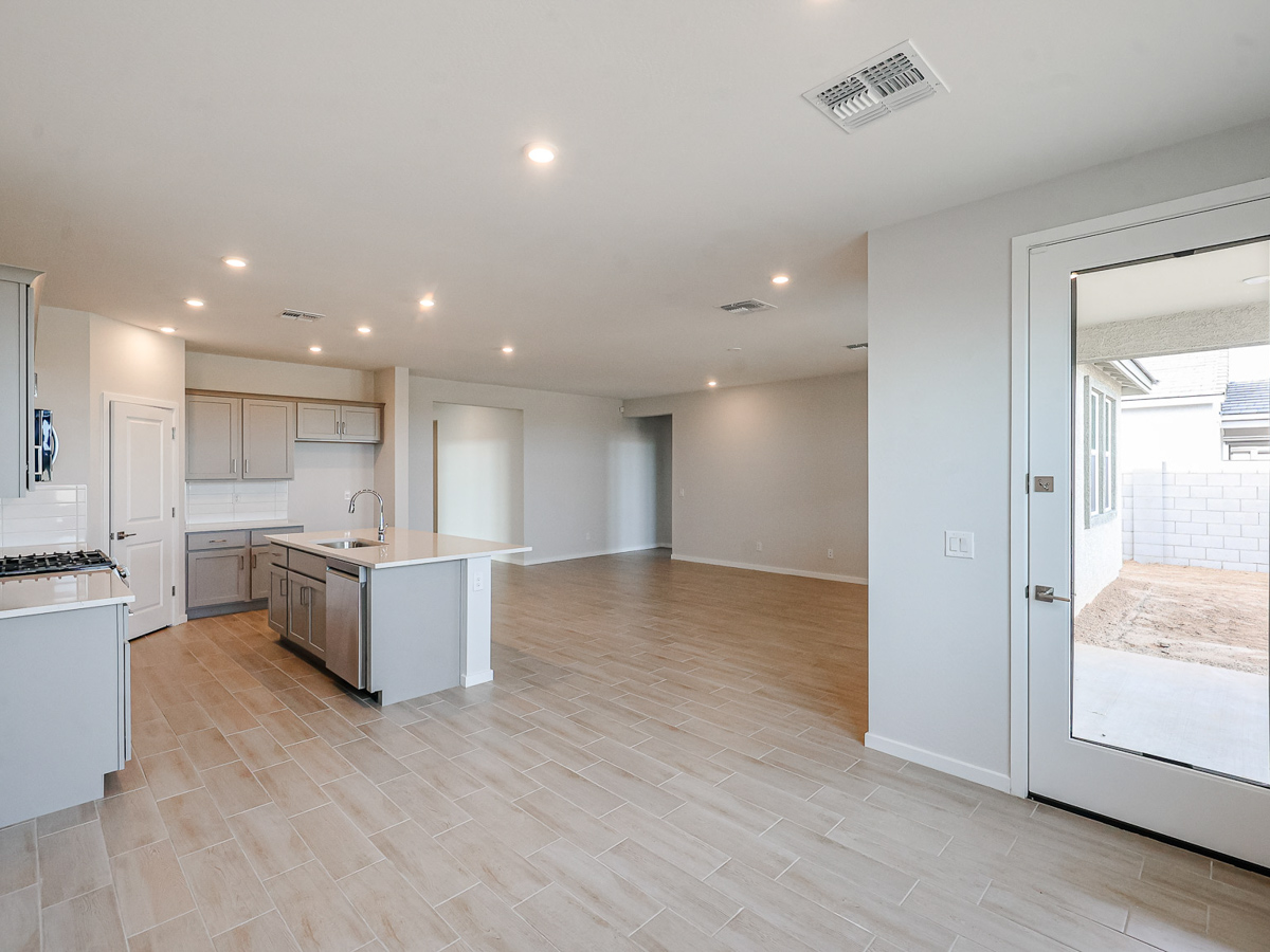 A large kitchen with white cabinets.