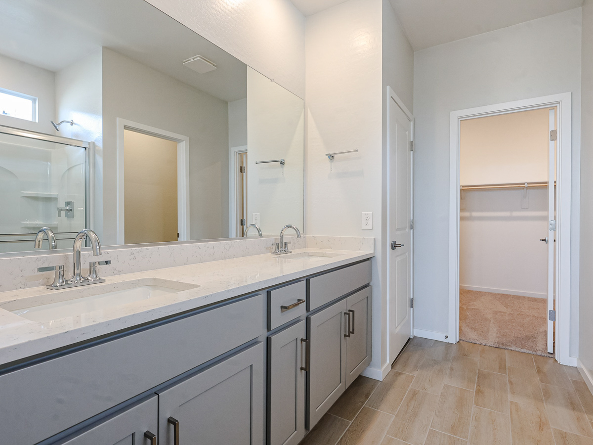 A bathroom with a large mirror.