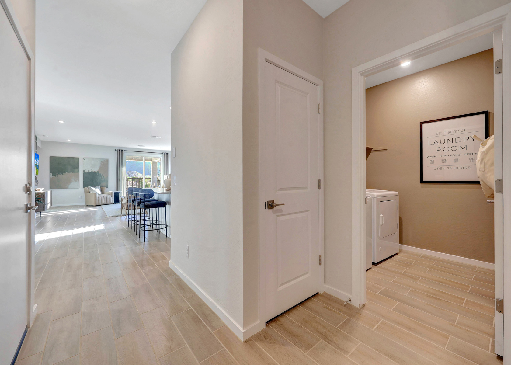 A room with a wood floor and white walls.