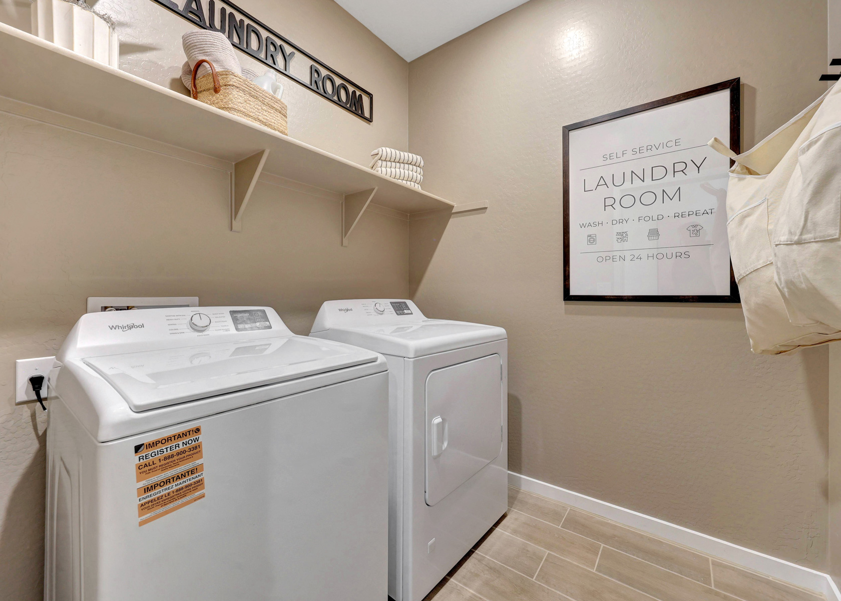 A laundry room with a sign.