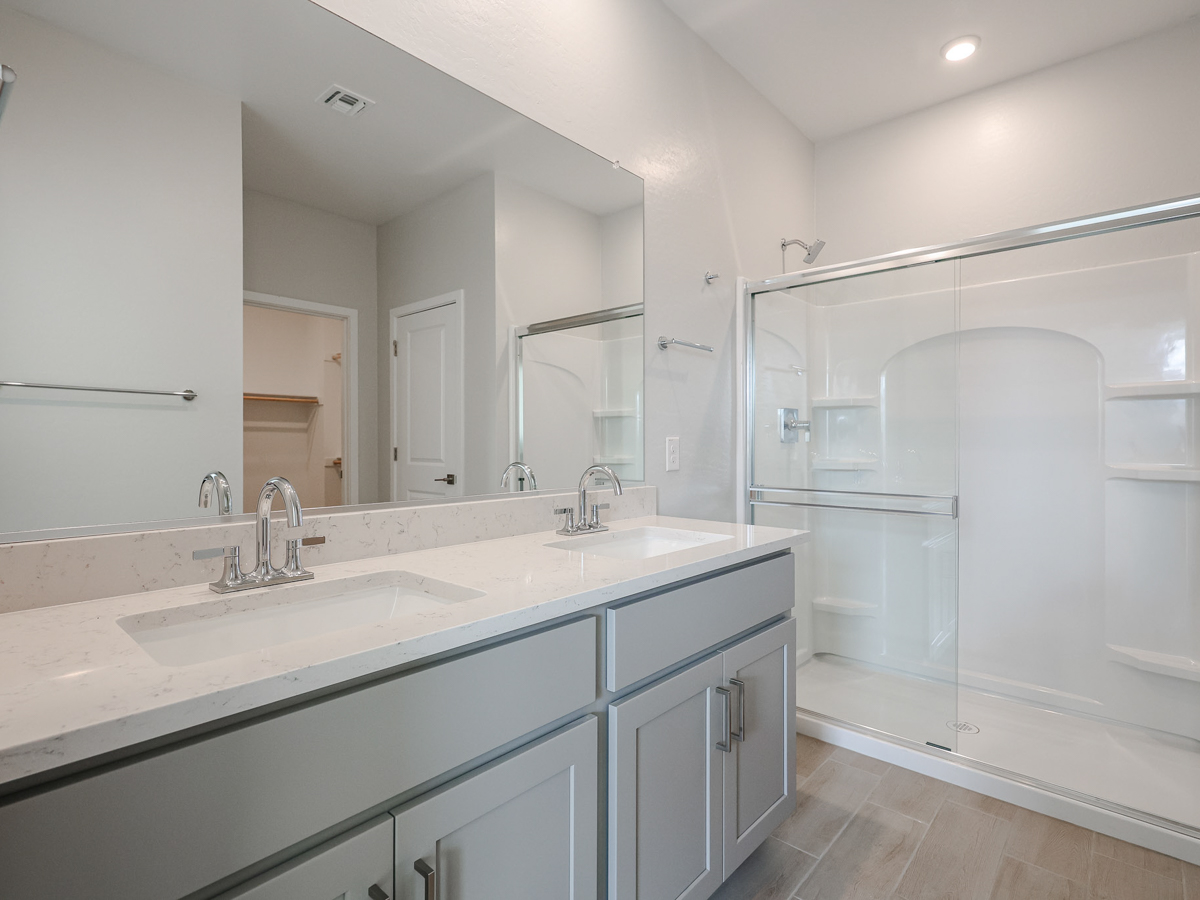 A bathroom with a glass shower.