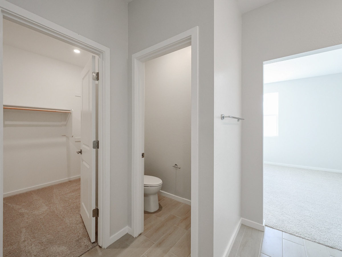 A bathroom with a toilet and shower.