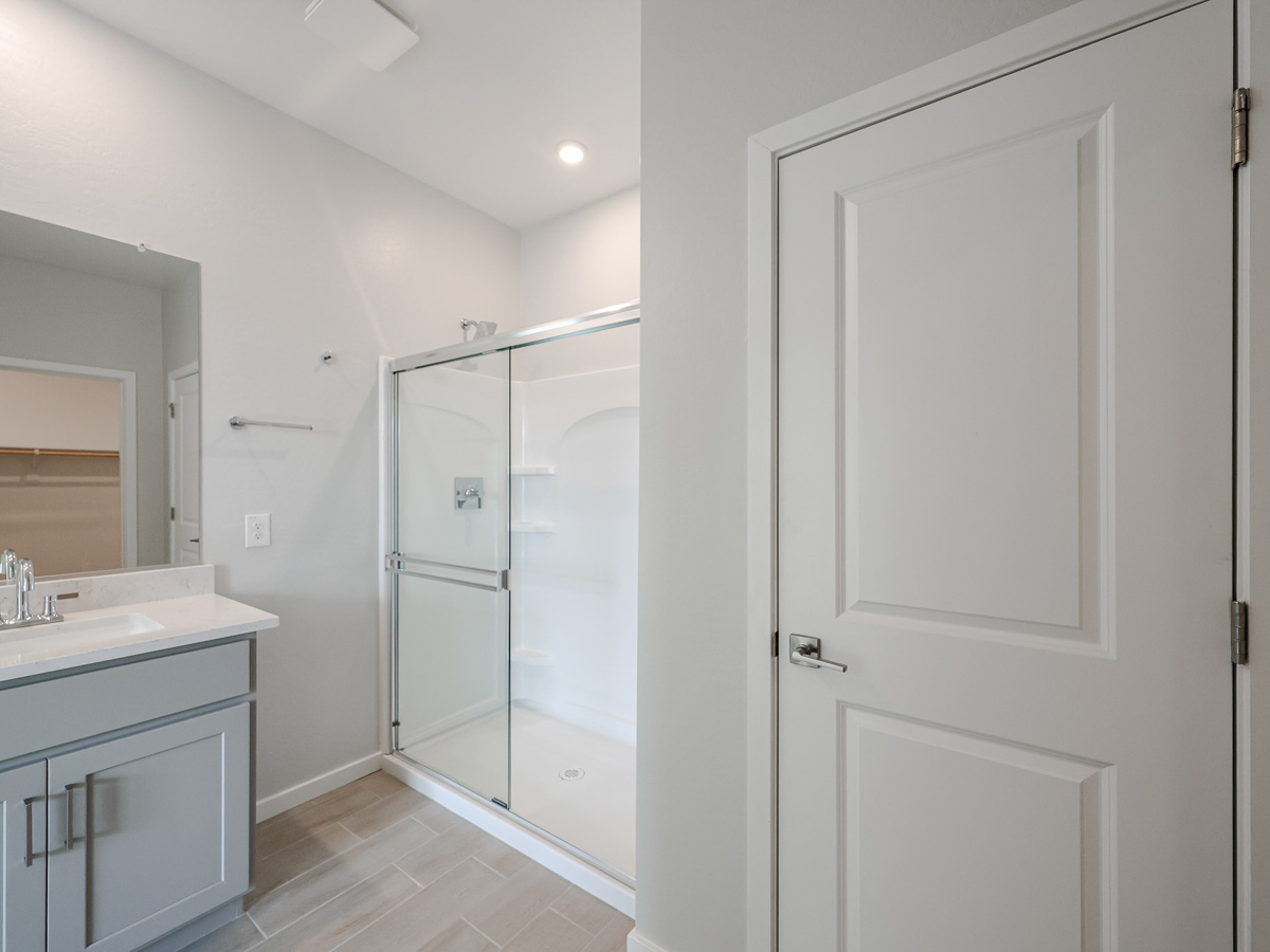 A bathroom with a glass shower.