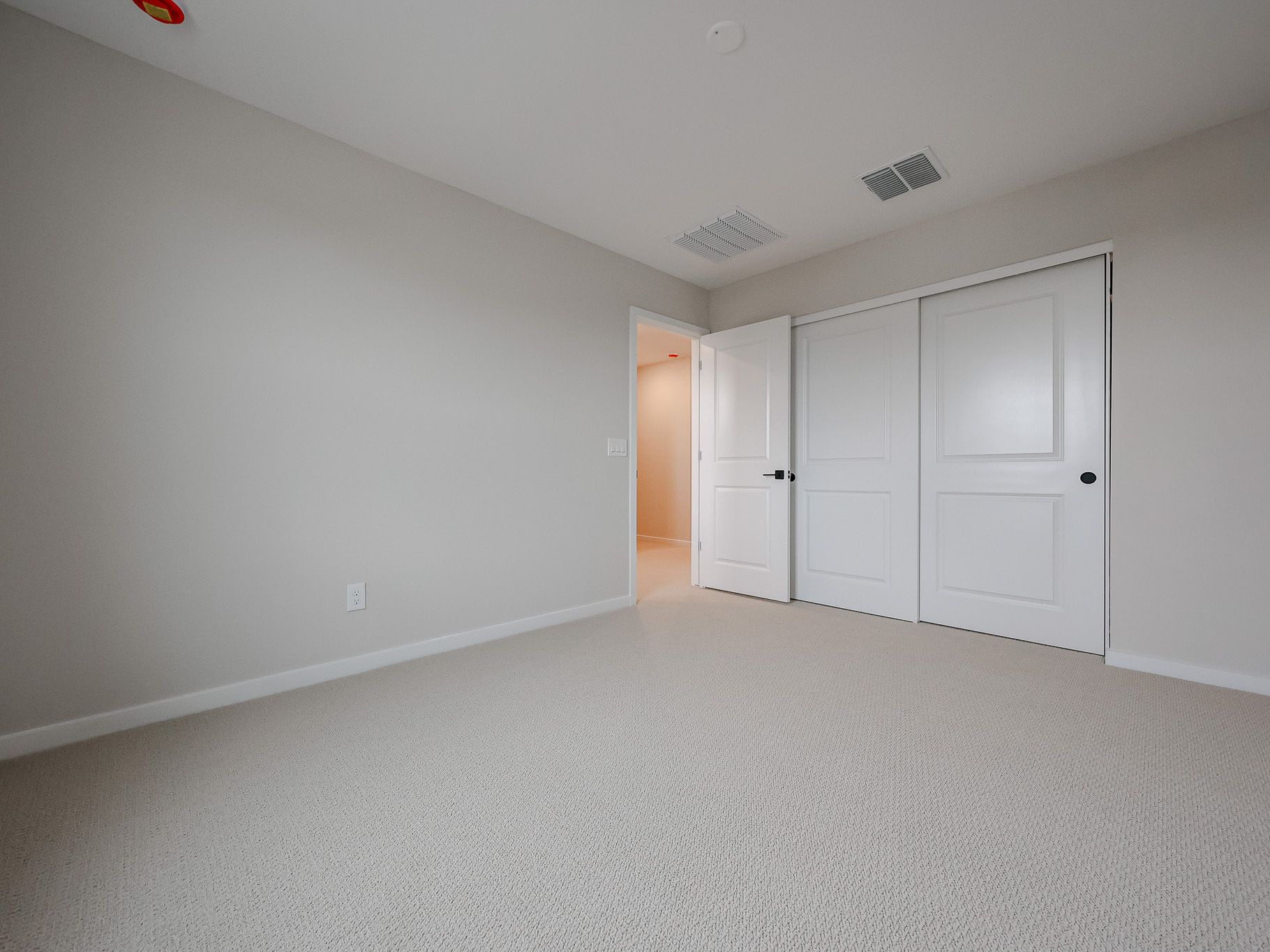 A room with white doors.