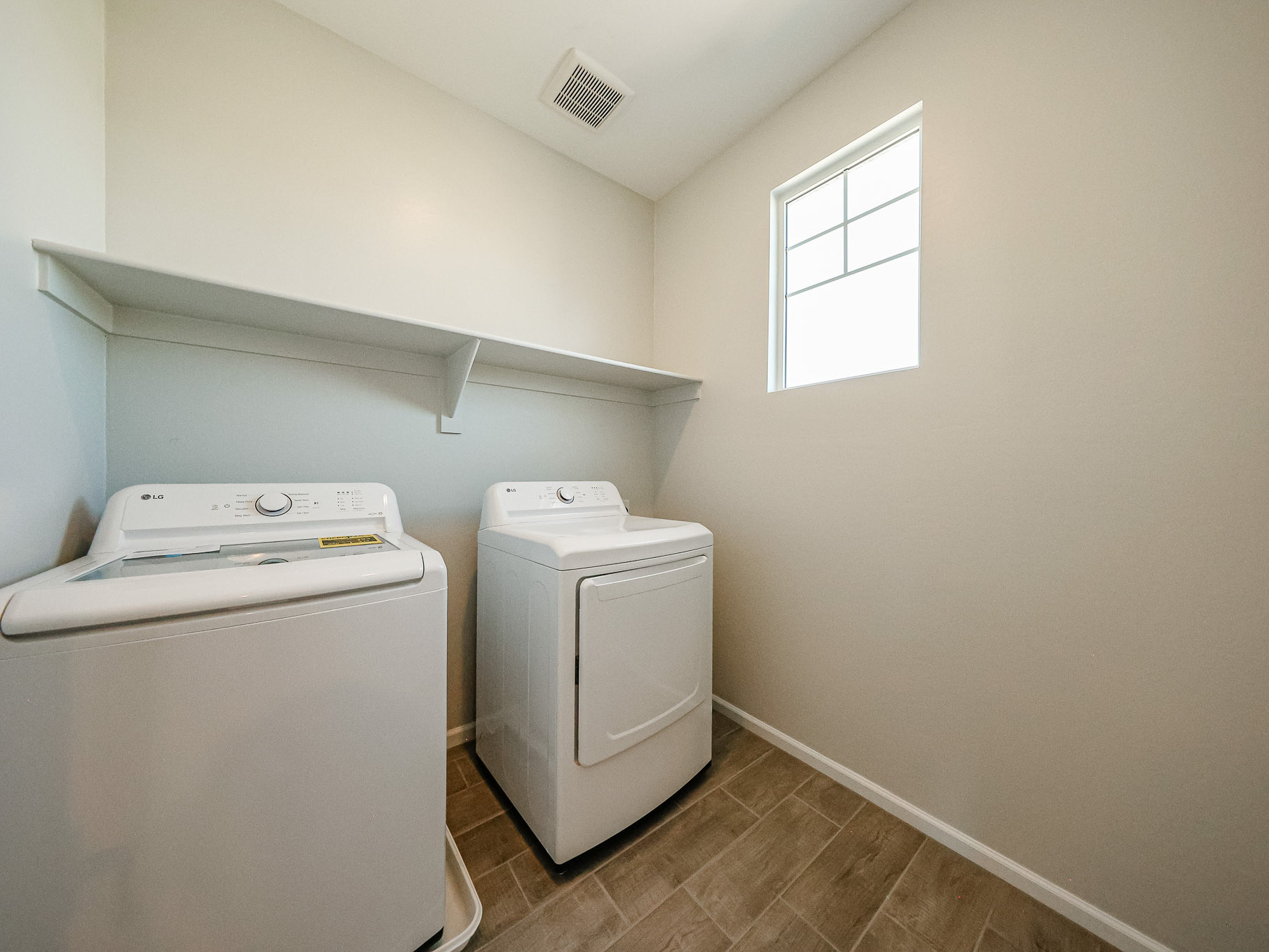 A laundry room with a washer and dryer.