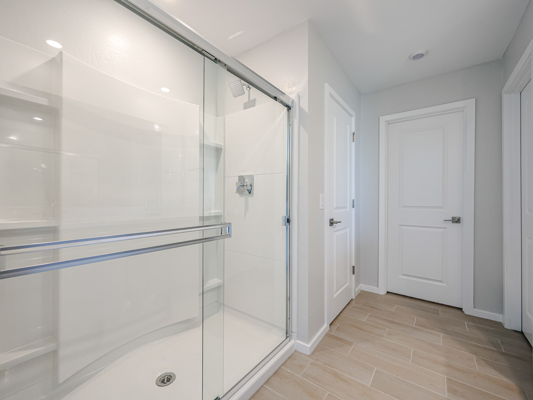 A bathroom with a glass shower.