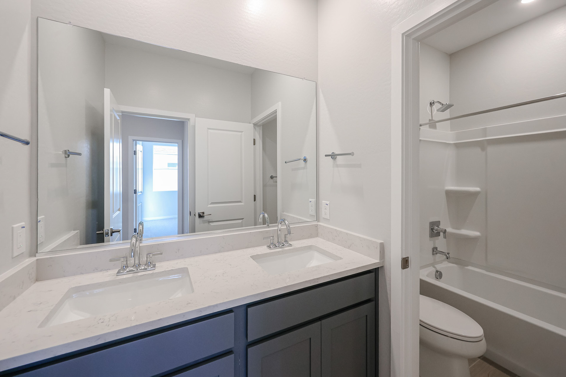 A bathroom with a sink and a toilet.