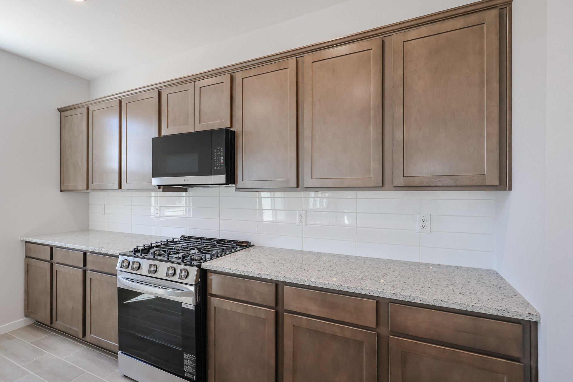 A kitchen with wooden cabinets.