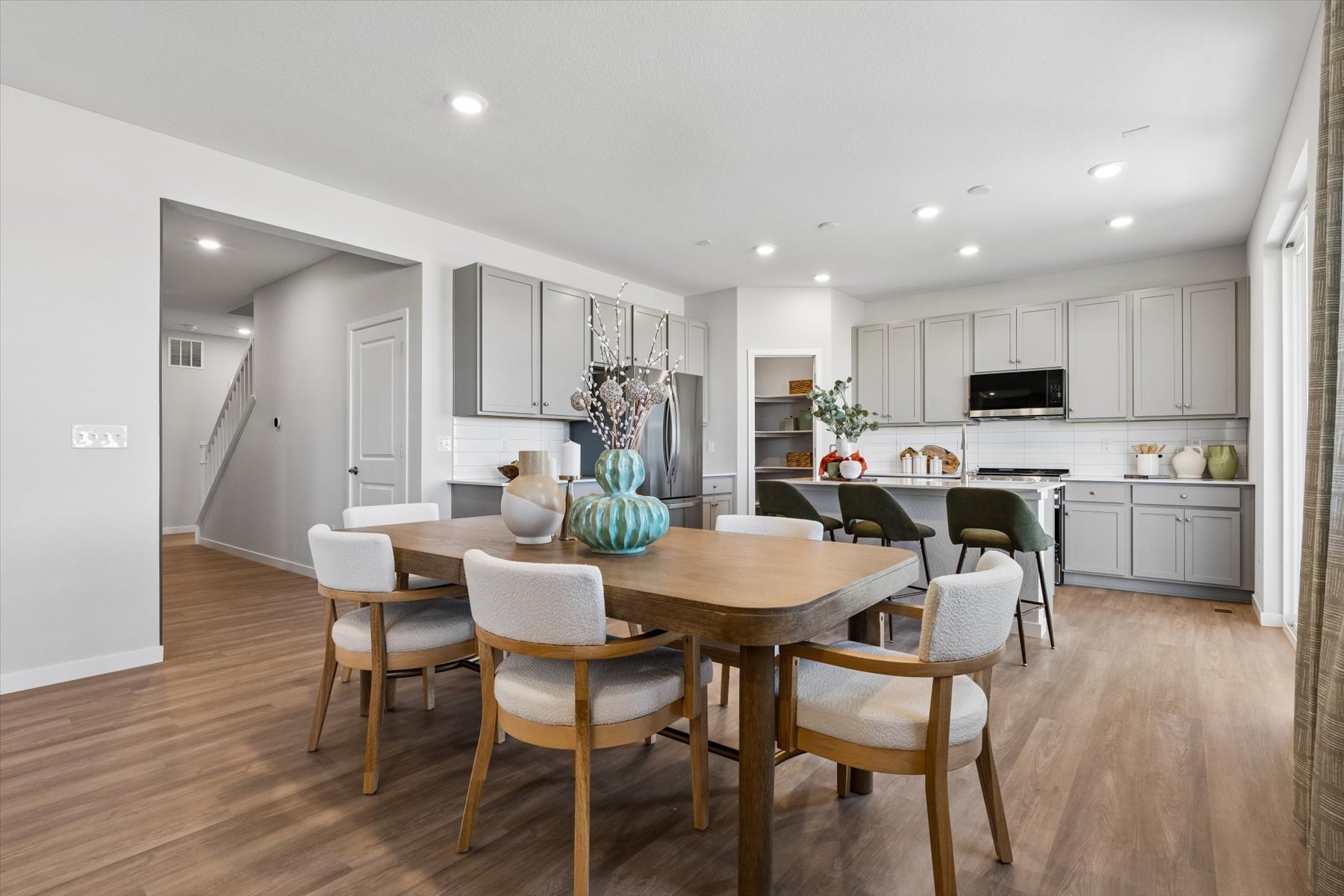 A kitchen with a dining table.