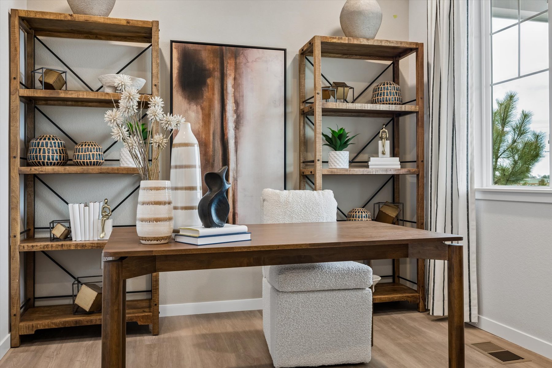 A room with a table and shelves.