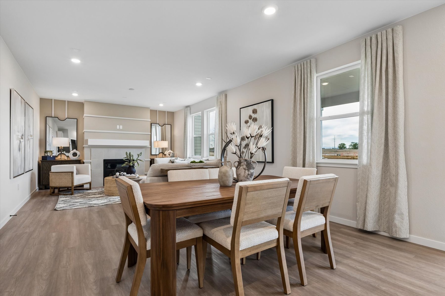 A dining room with a large table.