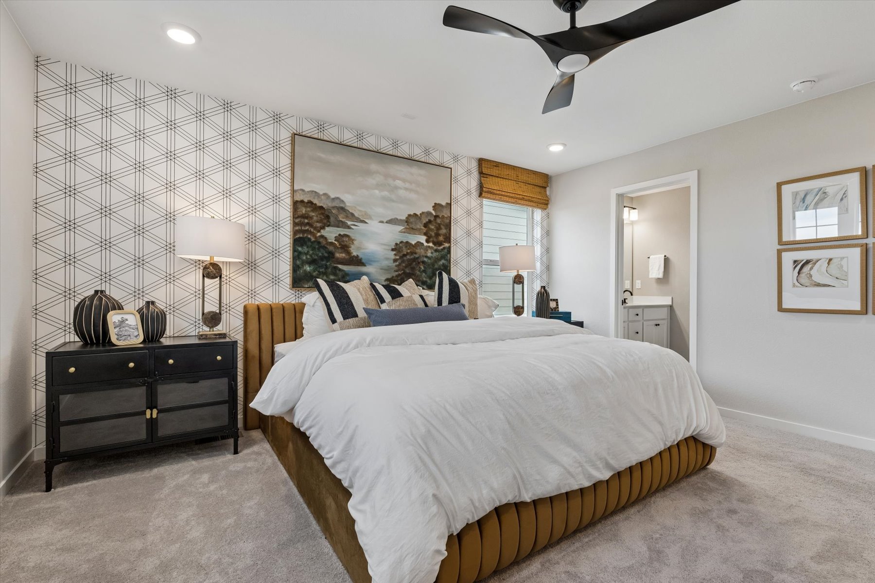 A bedroom with a large bed.