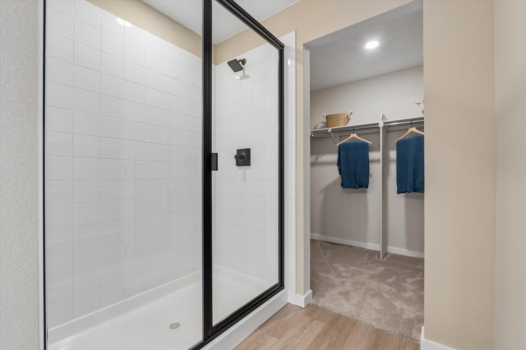 A bathroom with a glass shower.