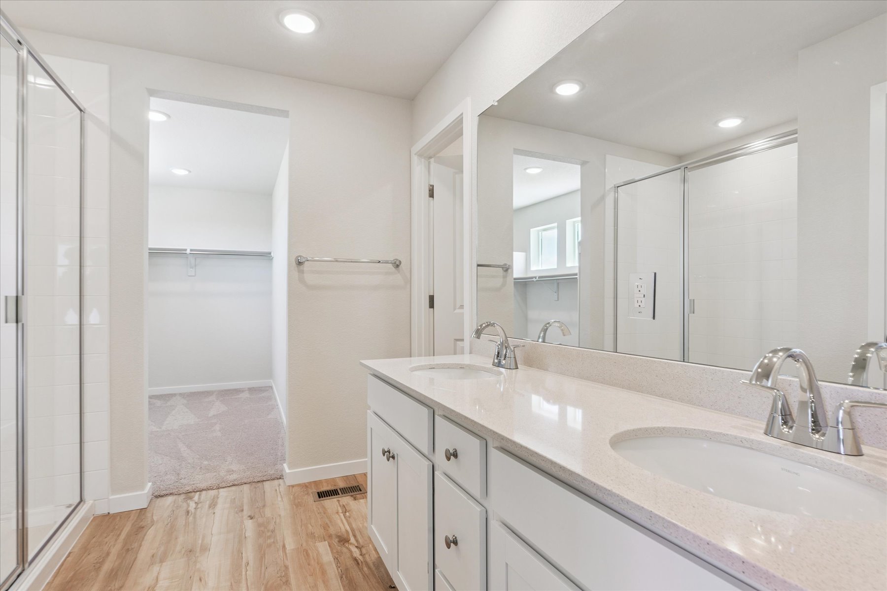 A bathroom with a glass shower.