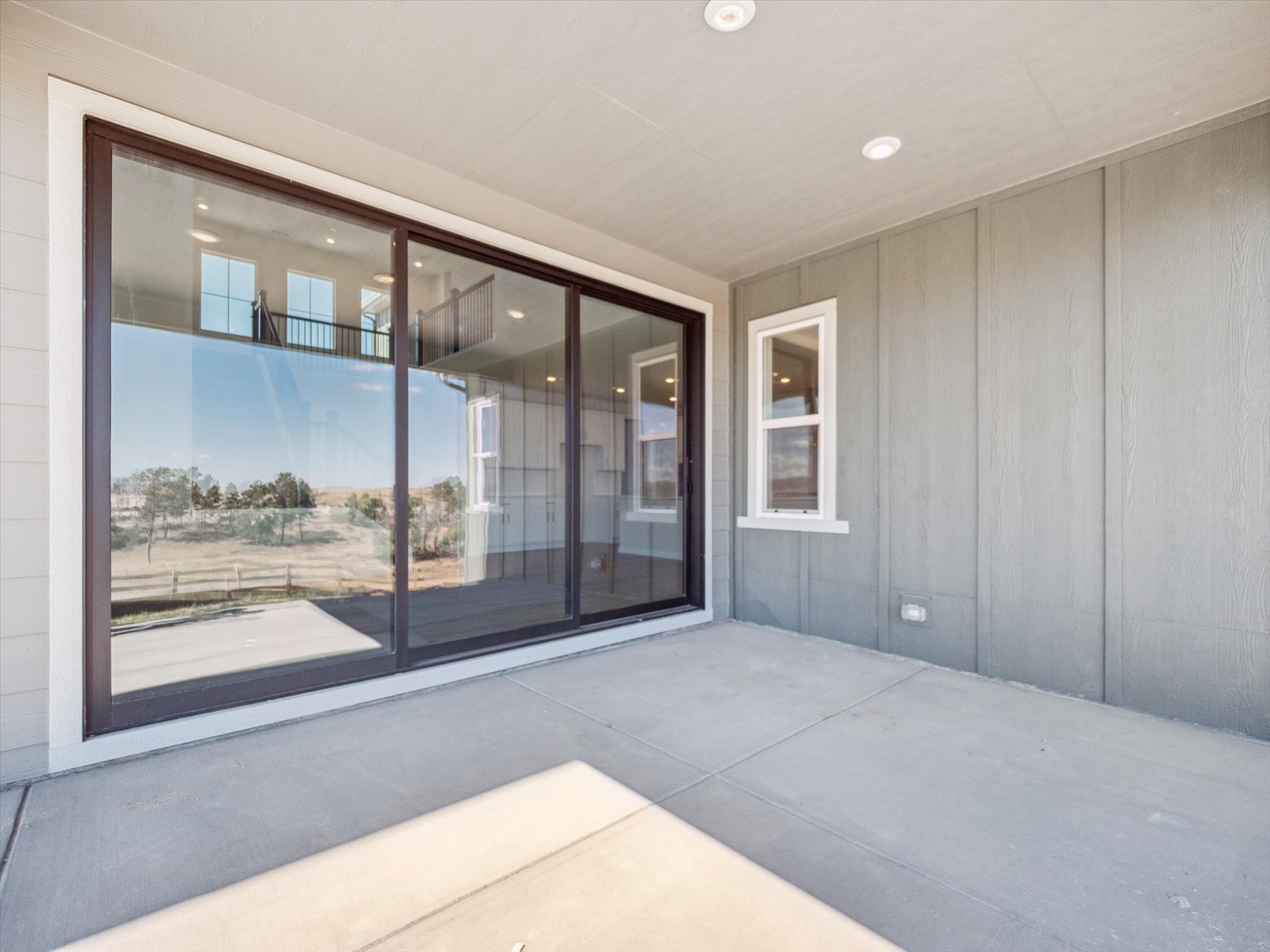 A room with a large glass window.