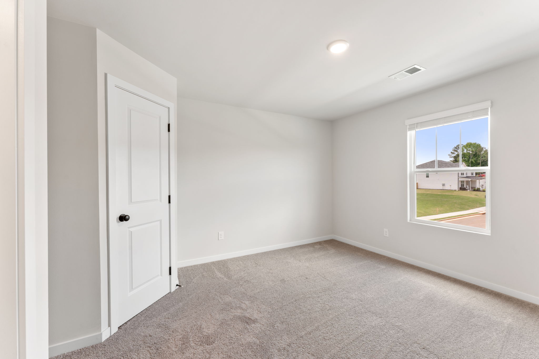 A room with a door and a window.