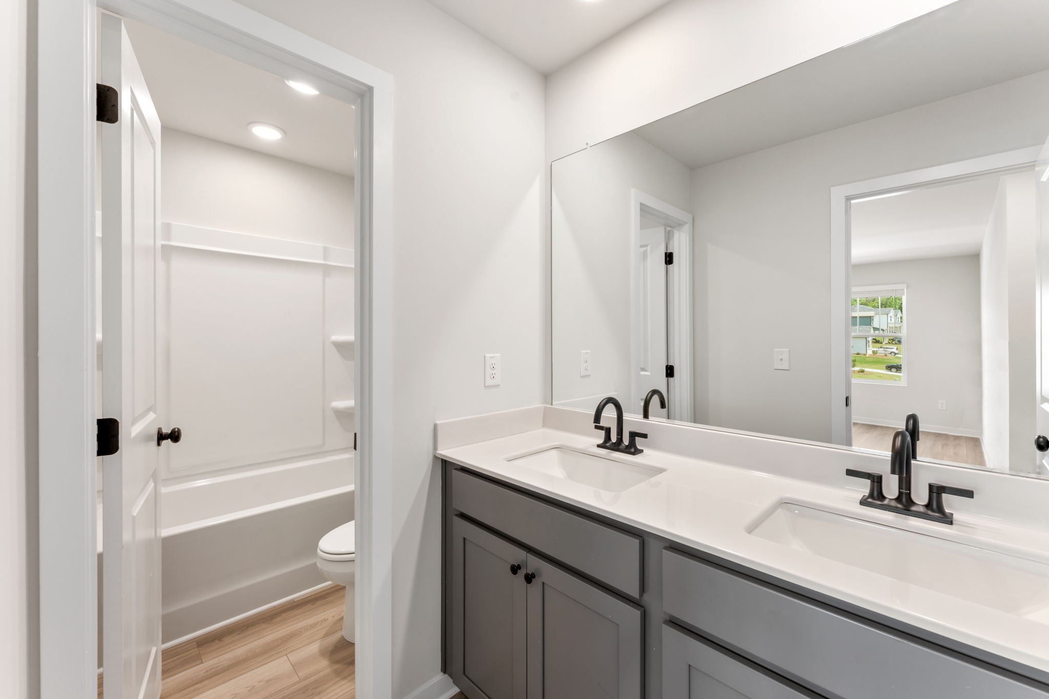 A bathroom with a sink and a toilet.