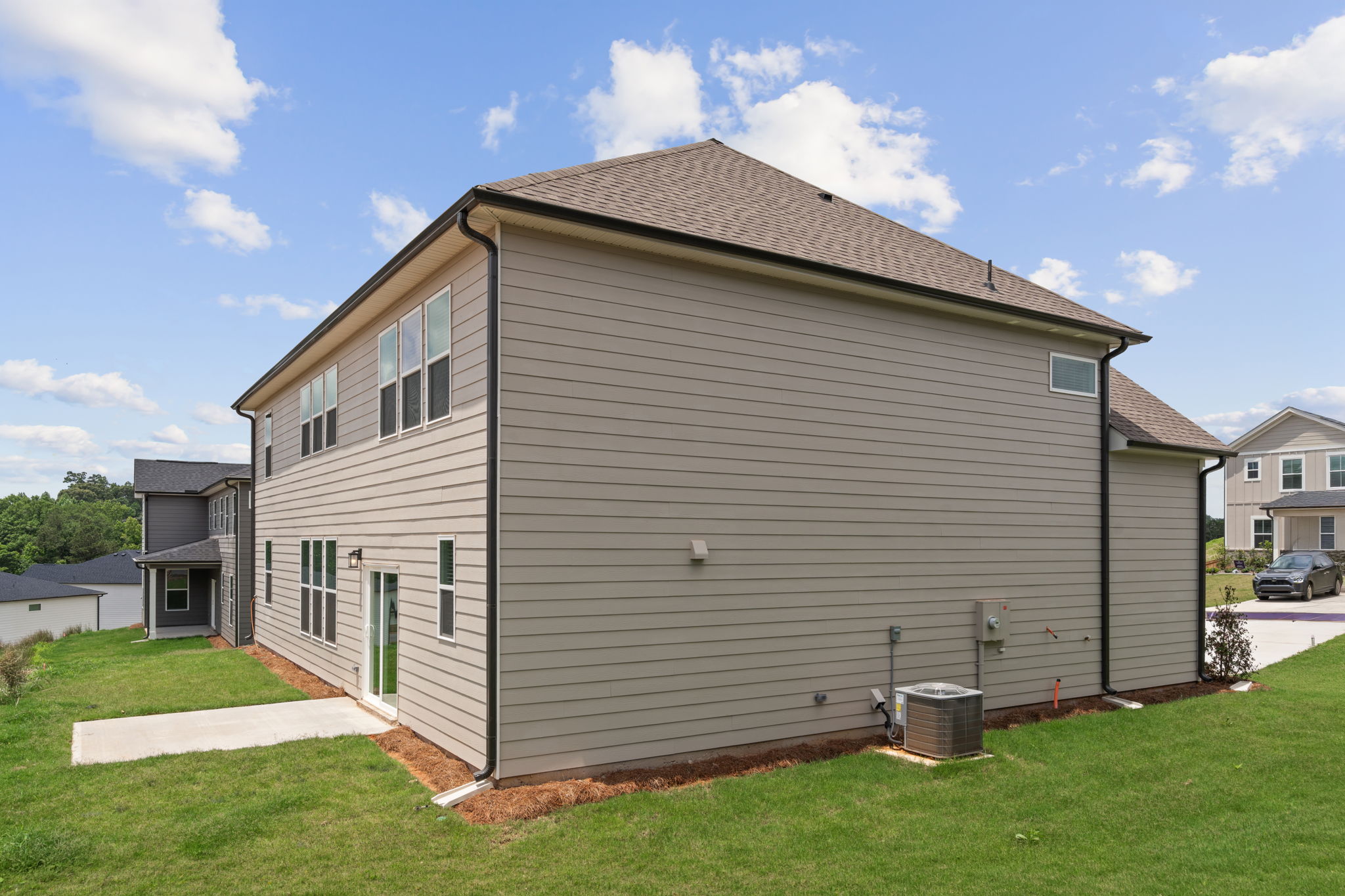 A house with a grass yard.
