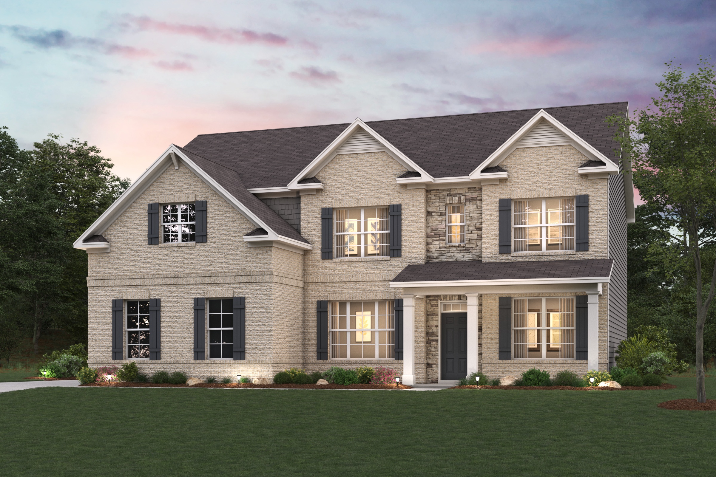 A large house with a lawn in front of it.