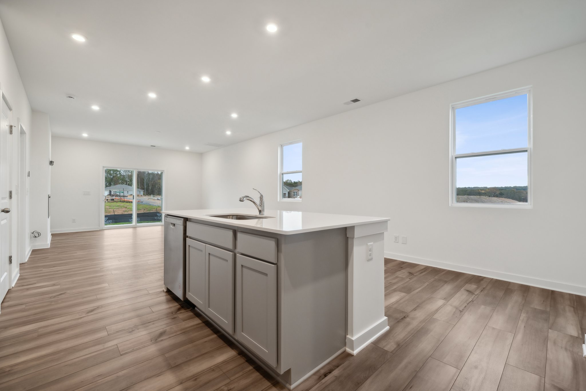 A kitchen with wooden floors.