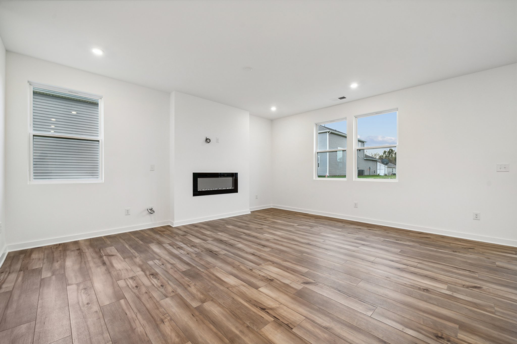 A room with a wood floor and a wood floor.