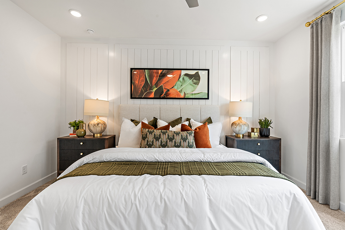 A bedroom with a large bed.